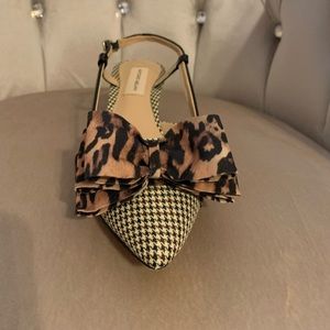 Antonio Melani style Galorie color hounds tooth, with a leopard bow.